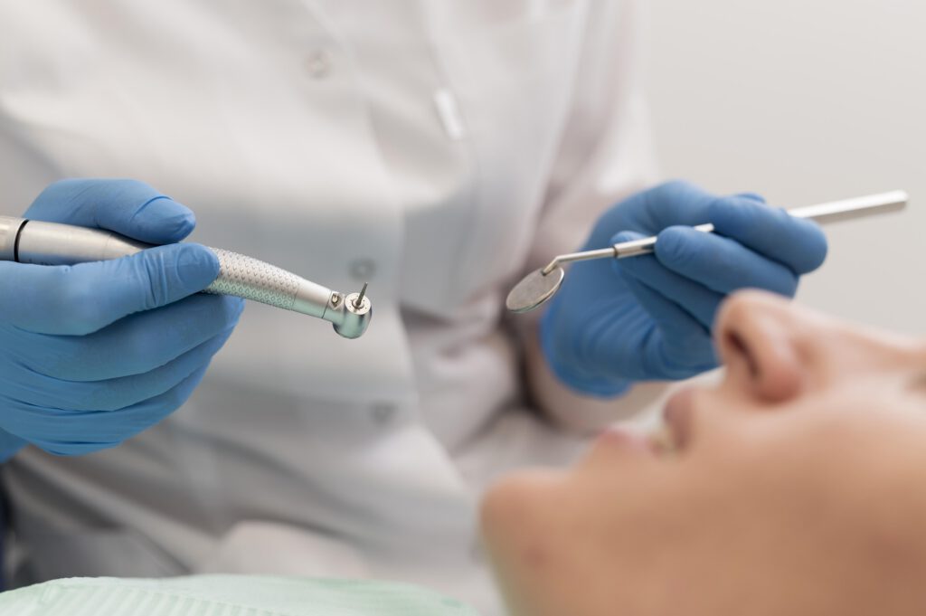 female patient having procedure done dentist
